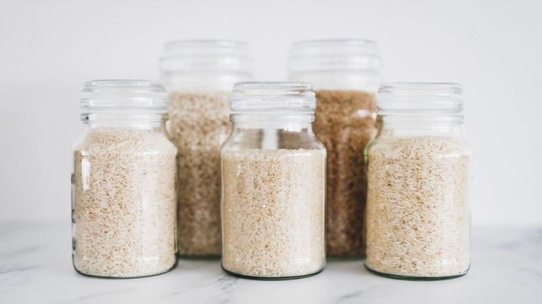 Glass jars containing different varieties of rice