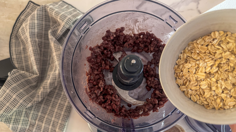 adding oats to food processor