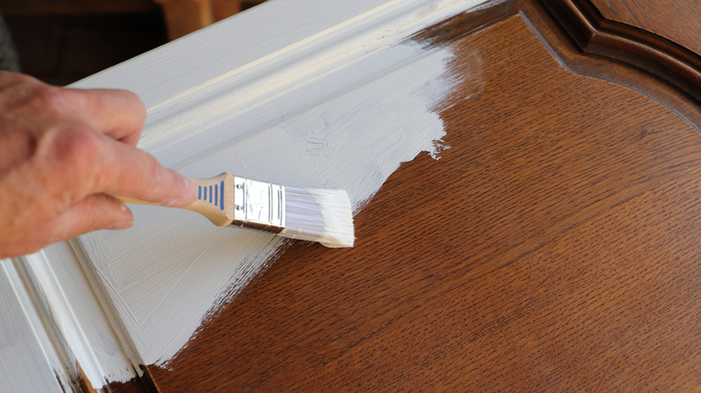 Refinishing a timber cabinet door with white paint