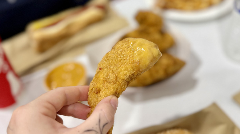Chicken strip dipped in sauce