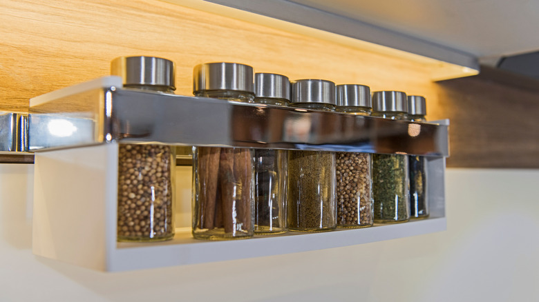 Hanging spice rack with metal finishes and seasonings stored