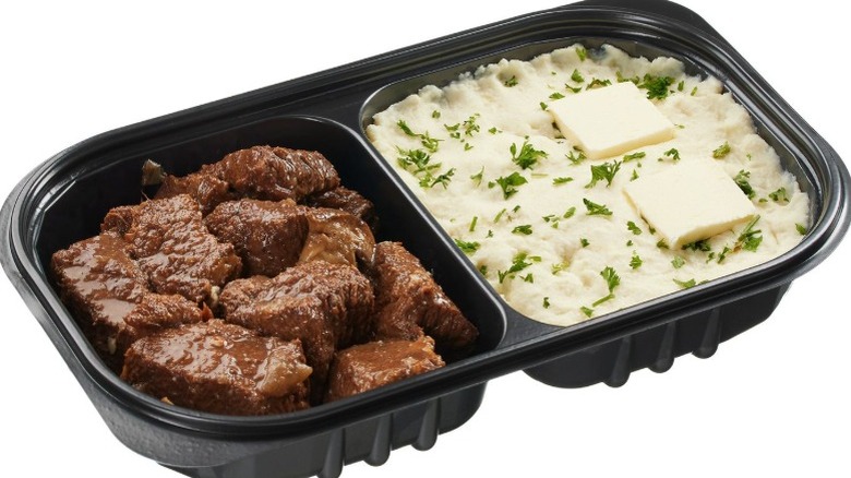 A container of Kirkland Signature Braised Beef with Yukon Mashed Potatoes