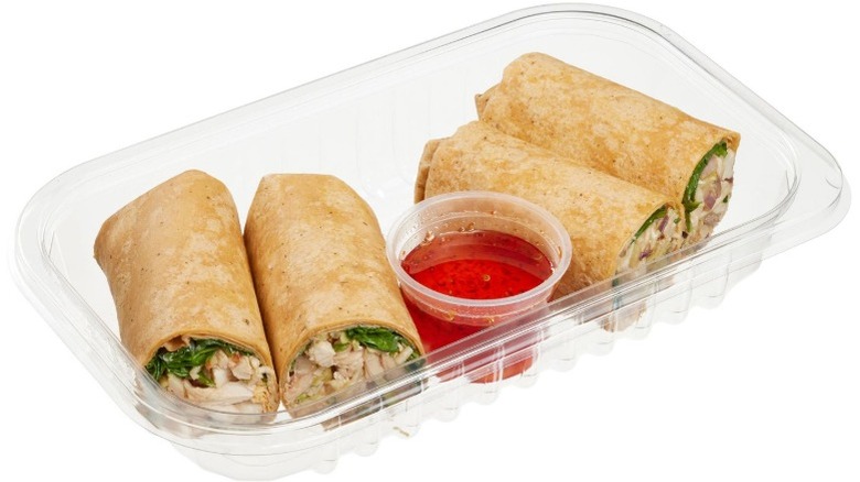 Two Kirkland Signature Thai Chili Wraps with Sweet Chili Sauce on a white plate