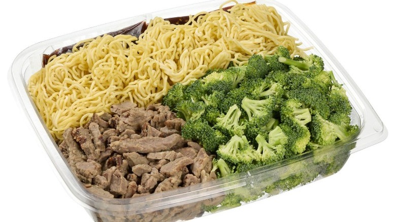 A container of Kirkland Signature Beef and Broccoli with Noodles