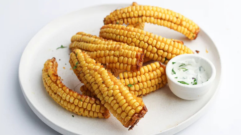 Air Fryer Corn Ribs on white plate with dipping sauce