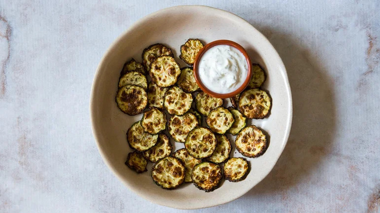 Air Fryer Zucchini Chips with Mint Dip in wide bowl