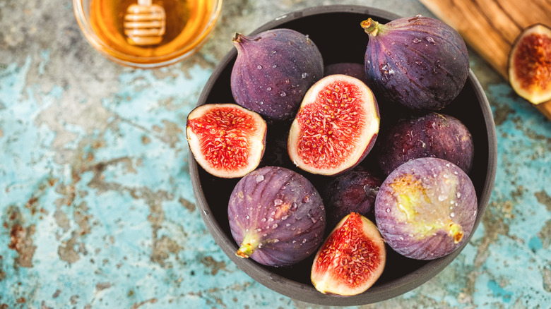 Bowl of fresh figs, some cut in half