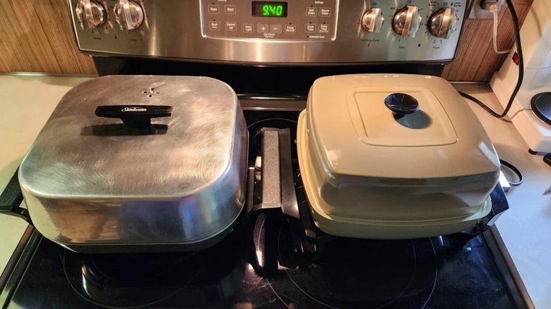 Two vintage electric frying pans on stovetop