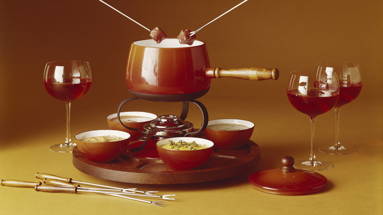 Vintage fondue set with wine glasses