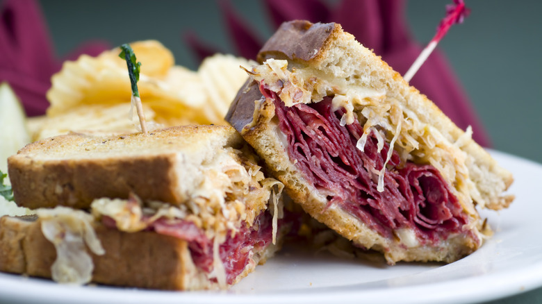 Close up of sliced Reuben sandwich