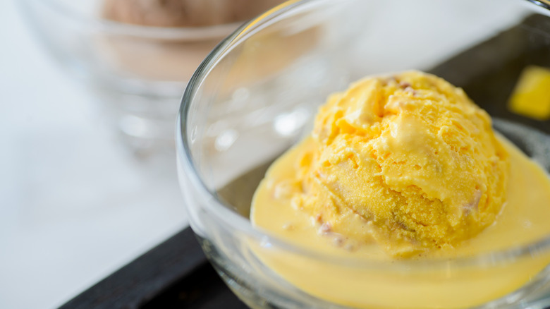 scoop of yellow ice cream in a bowl