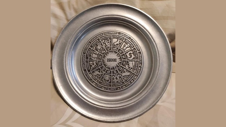 Pewter zodiac plate.