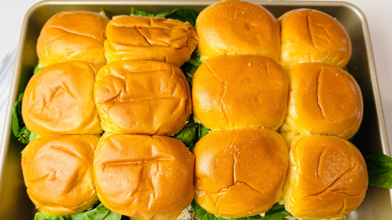 Sandwiches with brioche buns packed into baking pan