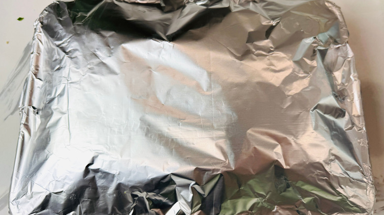 Foil covered pan on countertop