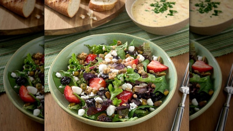 Salad with dried cherries, fresh strawberries, goat cheese crumbles, and pistachios from Sam's Club