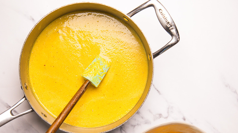 Coconut paste in wide pan.