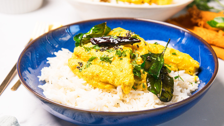 Blue bowl with rice topped with Goan ghotache sasav