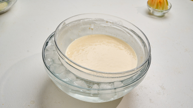 batter in a bowl over bowl of ice