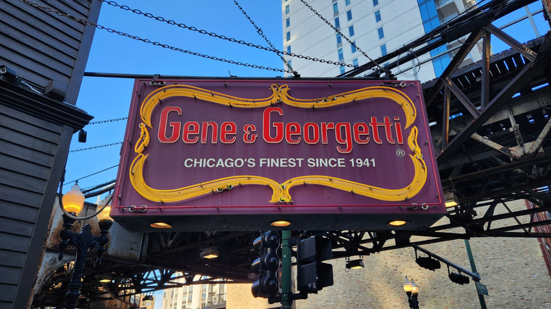 The exterior sign for Gene & Georgetti's restaurant, with a slogan that reads "Chicago's finest since 1941"