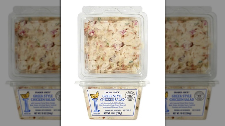 Two tubs of Trader Joe's Greek Style Chicken Salad stacked on a white background