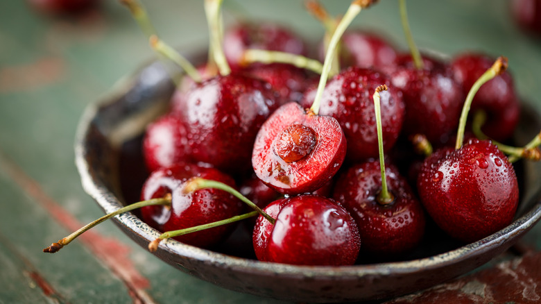 A bowl of fresh dark red cherries