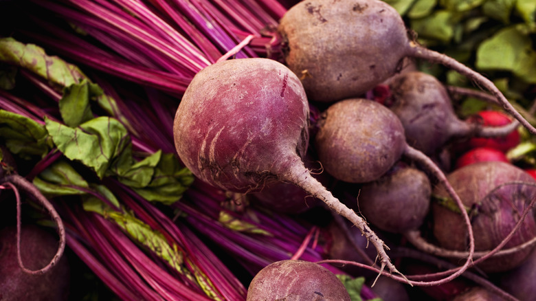 A pile of fresh purple beets