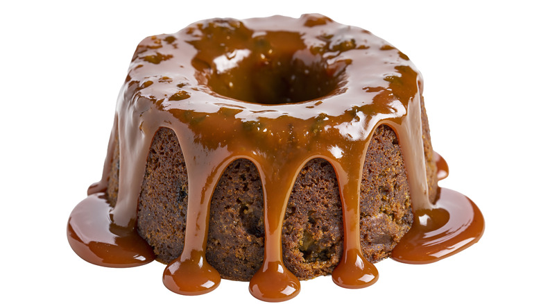 Bundt cake with caramel topping over the top