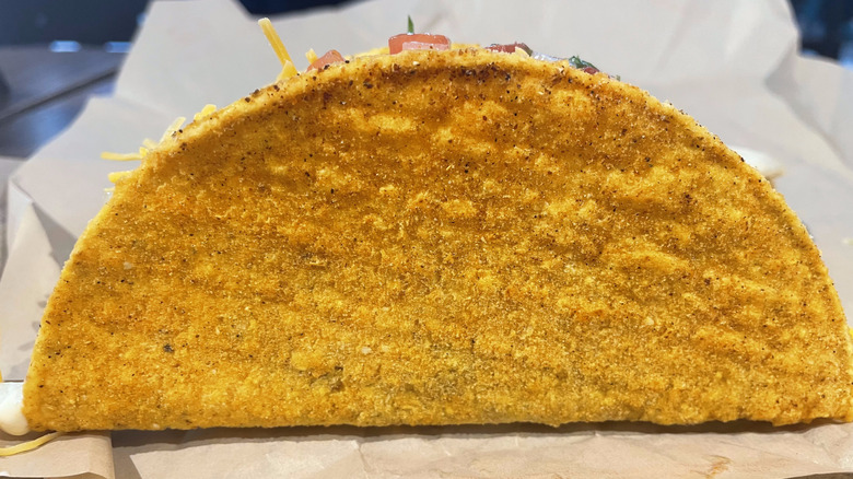 A close up picture of a Tajin covered taco shell.