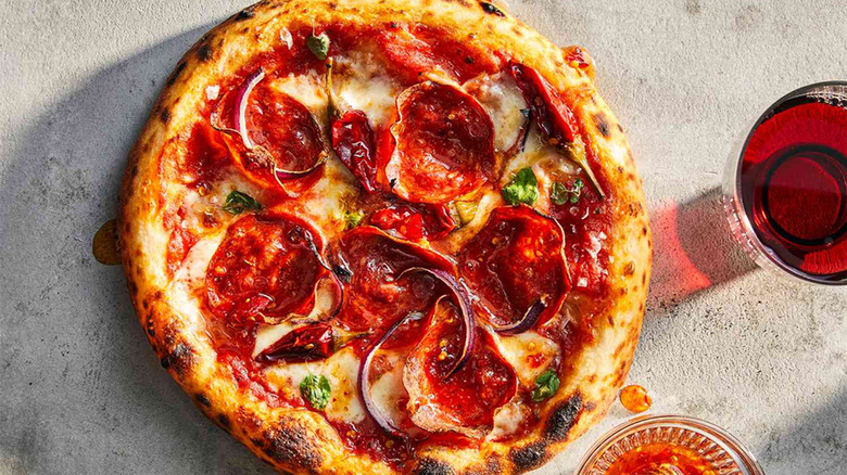 Neapolitan pizza topped with pepperoni and Calabrian chiles