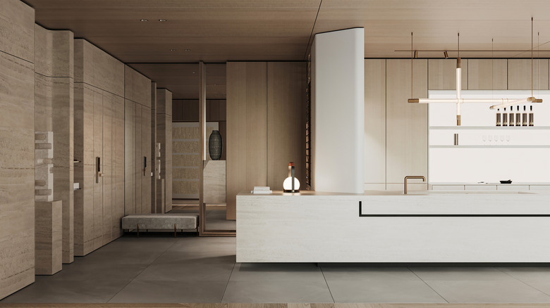 A modern, minimalist kitchen with limestone