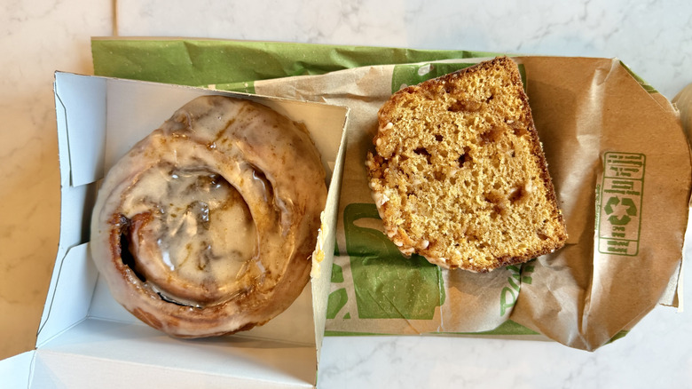 Panera Pumpkin Cinnamon Roll and Caramel Pumpkin Slice on a paper bag