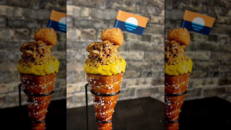 A Cream City Cone with cheese curds, mustard, and pretzel cone from WürstBar in Wisconsin.