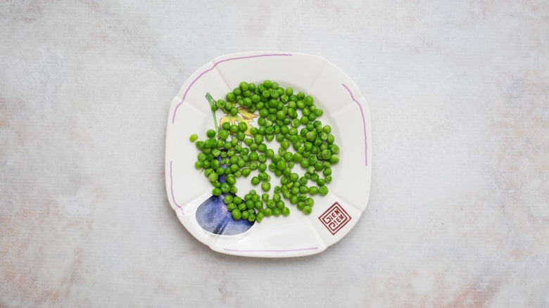 Steamed peas on plate