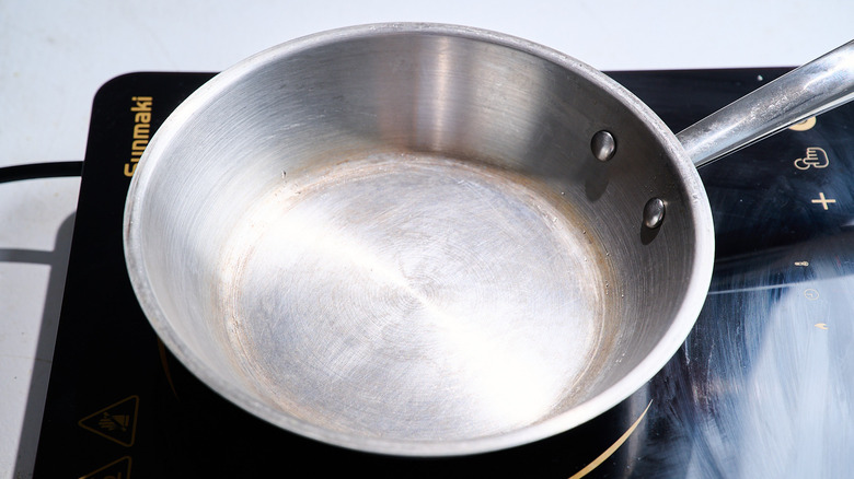 heating a skillet on a stove