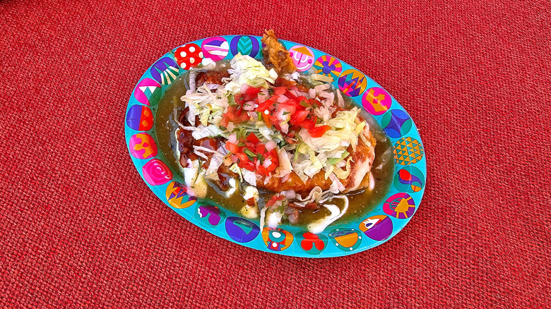 Beef and Cheese Tamale a la Plancha on a plate