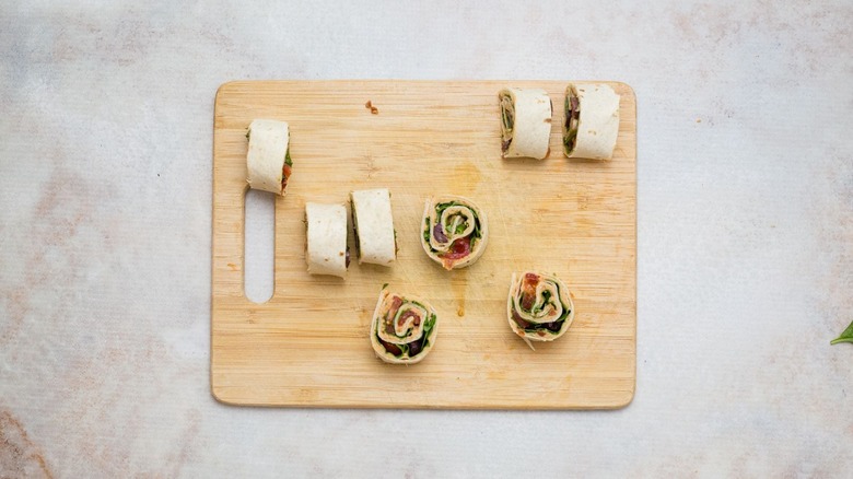 Sliced pinwheels on wooden board