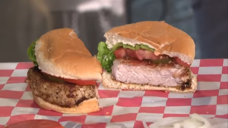 Pork chop sandwich with lettuce and tomato