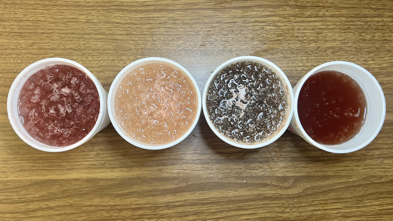 4 Sonic Hotumn drinks in to-go cups from the top.