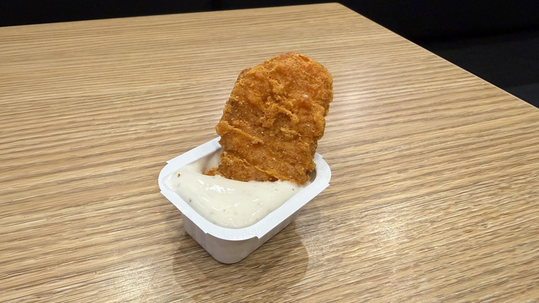 a Spicy Chicken McNugget dunked in ranch sauce