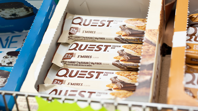 Close-up of Quest bars in an open box at a grocery store