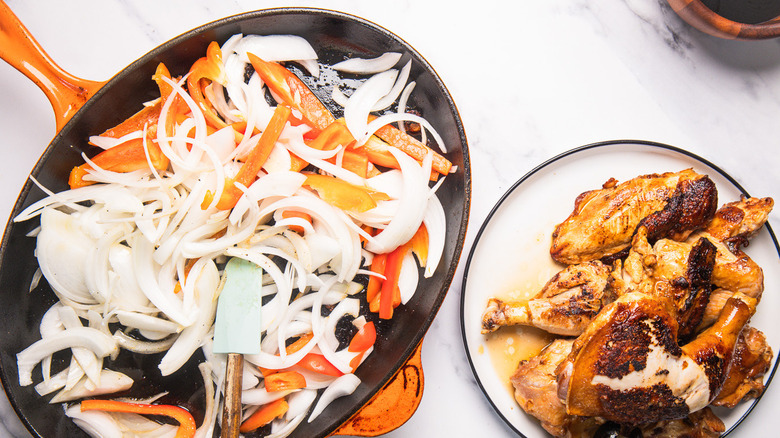 Onions and peppers in pan