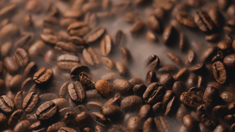 Coffee beans on brown background