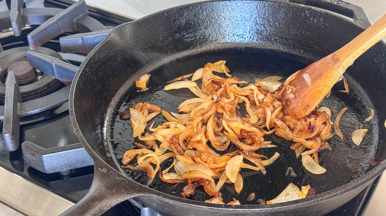 Golden sauteed onions in skillet