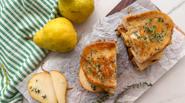 cut grilled cheese with thyme and pears