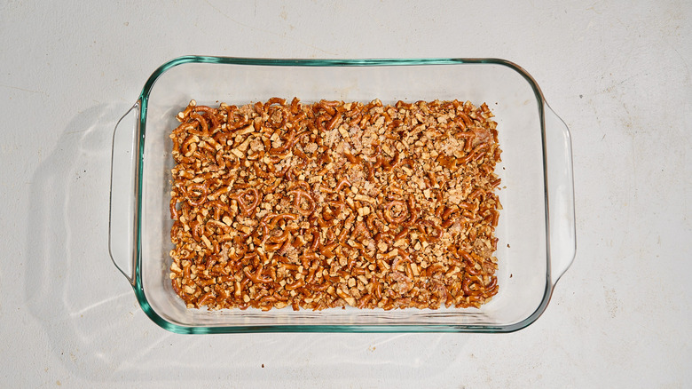 baked pretzel crust in a casserole dish