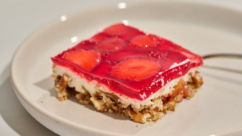 slice of strawberry pretzel salad on a plate