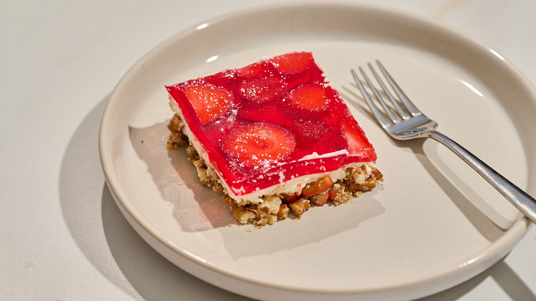 slice of strawberry pretzel salad on a plate