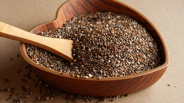 Spoon and chia seeds in a bowl.