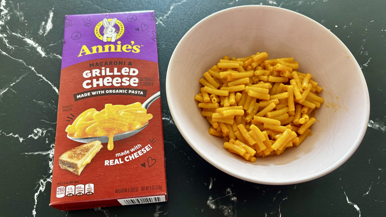 Annie's Grilled Cheese macaroni box next to mac and cheese in bowl