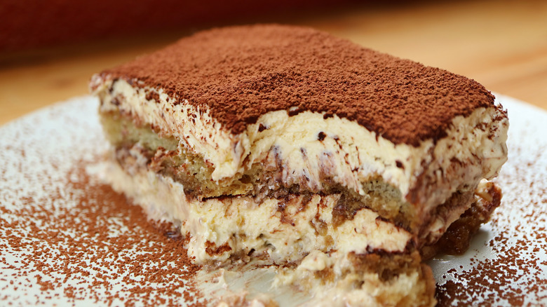Closeup of a half-scooped slice of Tiramisu